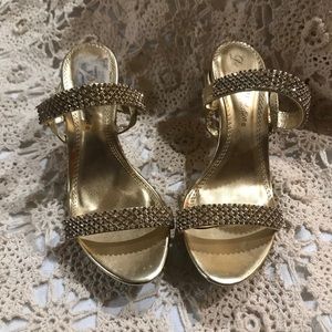 Woman’s bedazzled heels